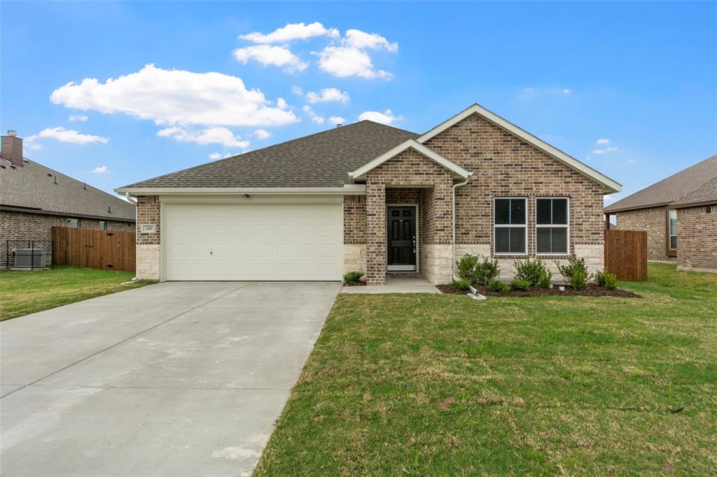 210 Pennington Road Josephine, TX 75173 - Photo 1 of 23 a front view of a house with a yard and garage