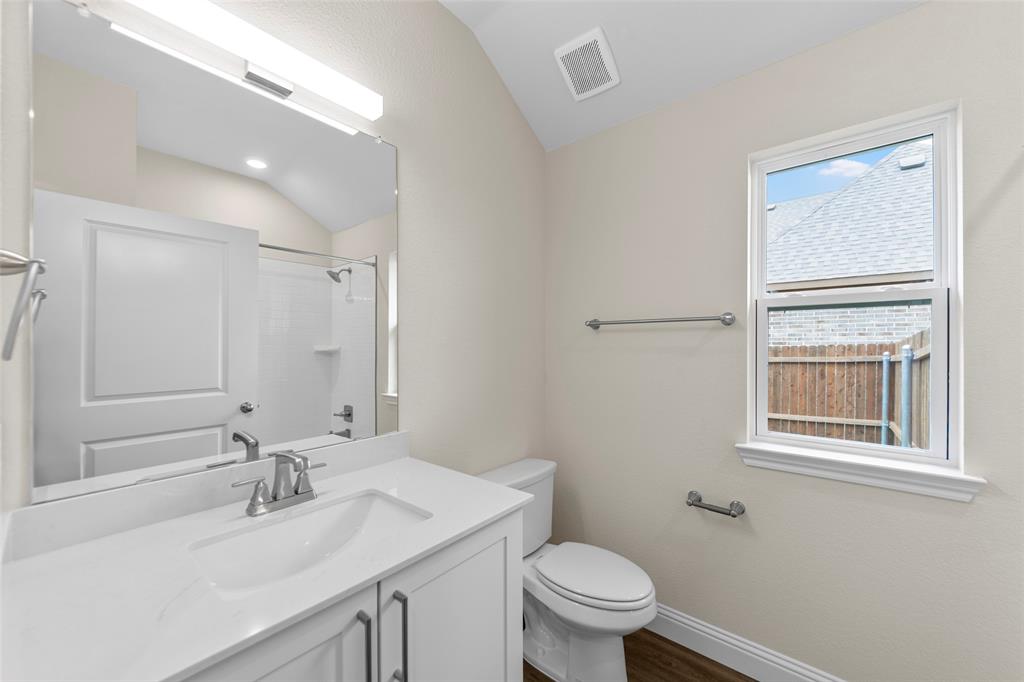210 Pennington Road Josephine, TX 75173 - Photo 11 of 23 a bathroom with a sink toilet and vanity