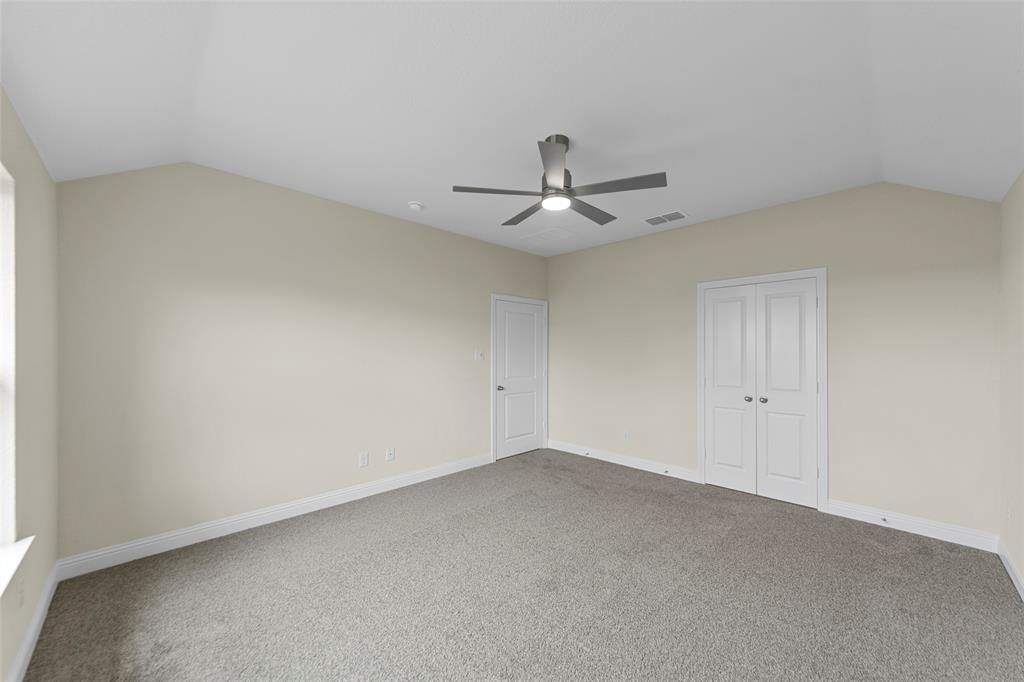 210 Pennington Road Josephine, TX 75173 - Photo 14 of 23 a view of a big room with a ceiling fan and window