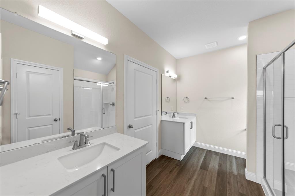 210 Pennington Road Josephine, TX 75173 - Photo 15 of 23 a bathroom with a sink double vanity granite tub shower and mirror