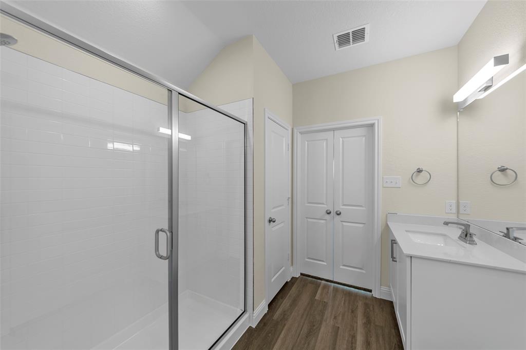 210 Pennington Road Josephine, TX 75173 - Photo 17 of 23 a bathroom with a sink a mirror and shower