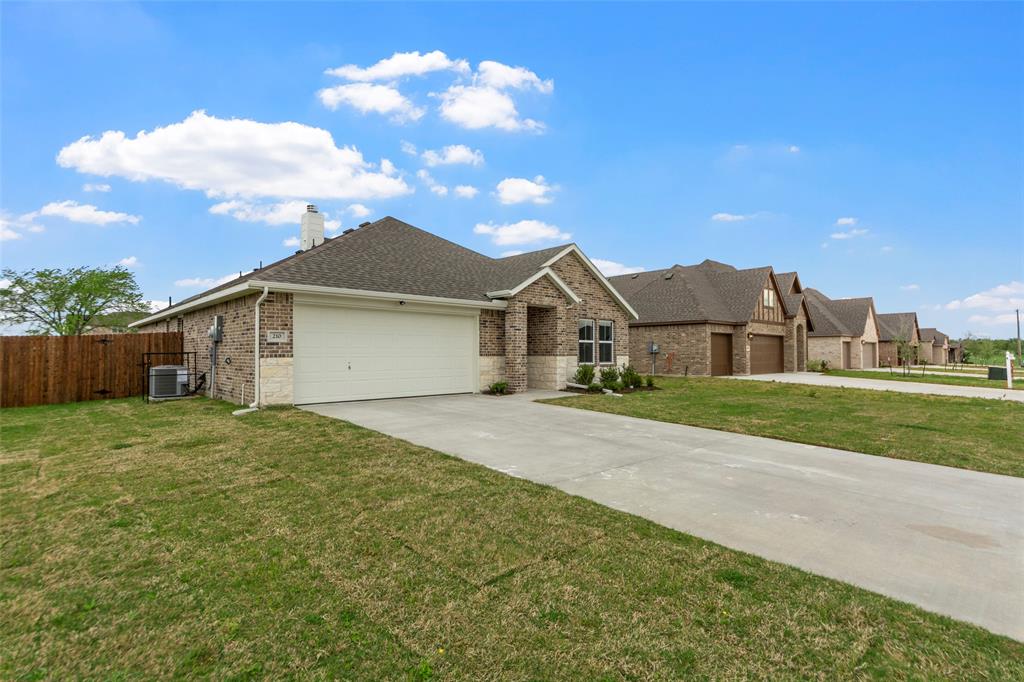 210 Pennington Road Josephine, TX 75173 - Photo 3 of 23 a front view of a house with a yard and garage