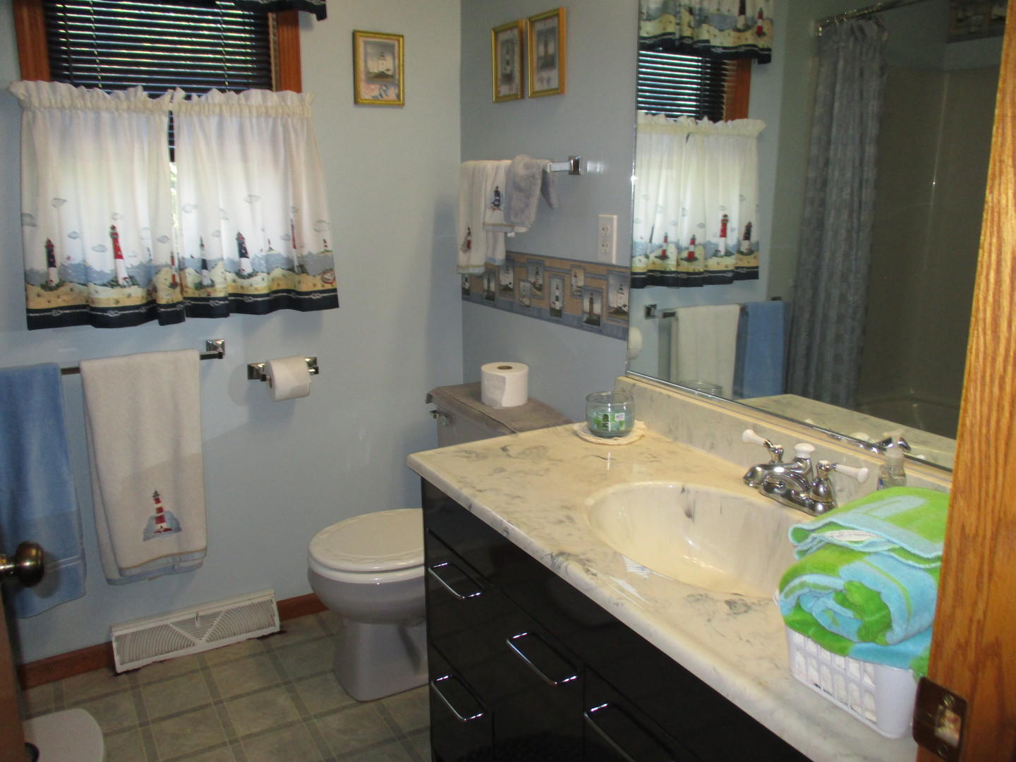3299 East 1951st Road Ottawa, IL 61350 - Photo 12 of 19 a bathroom with a granite countertop sink a toilet and a mirror