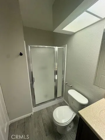 a white toilet sitting next to a bathroom sink