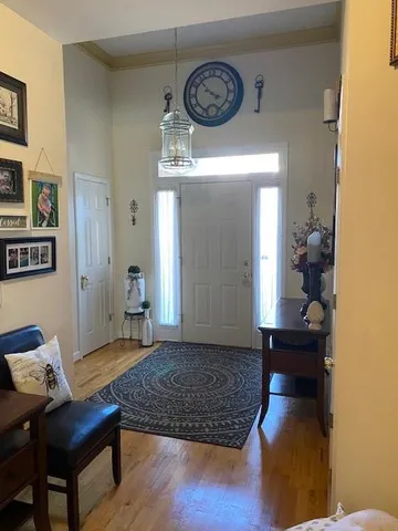 a kitchen with sink dining table and chairs