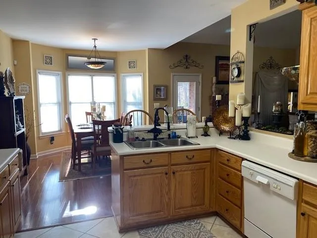 a kitchen with counter space dining table and chairs