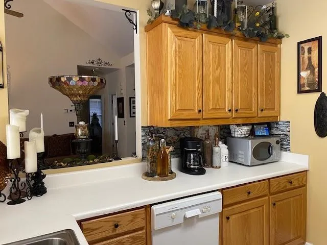 a very nice looking kitchen with a large window and stainless steel appliances