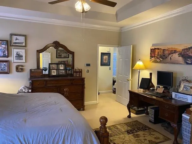 a bed room with a bed and a chair