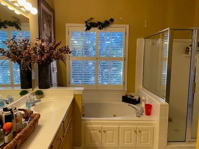 a bathroom with a sink mirror and vanity
