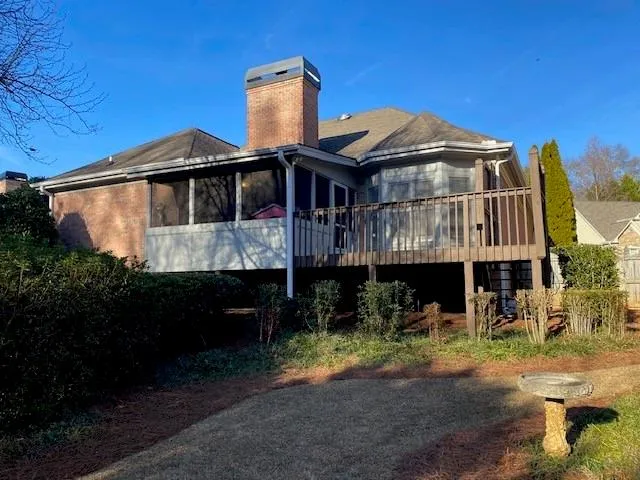 a view of swimming pool with outdoor seating