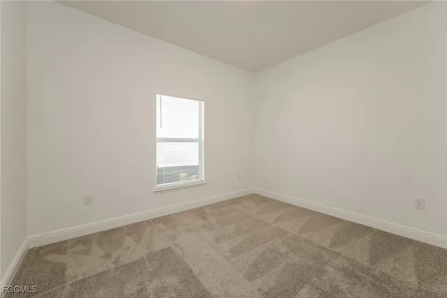 a bathroom with a granite countertop bathtub shower sink vanity mirror and toilet