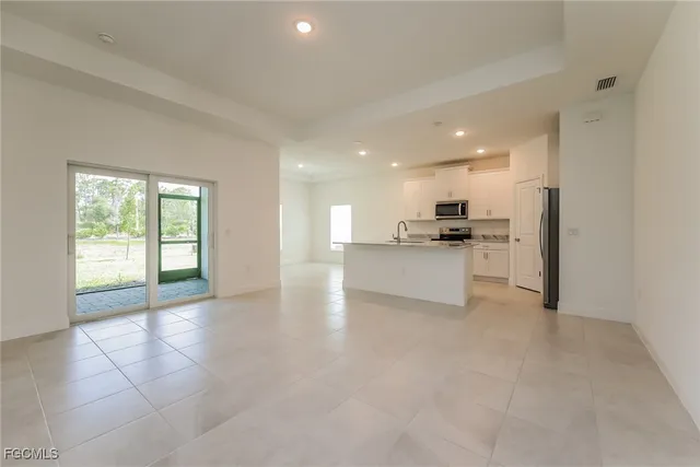 a view of a kitchen with a sink and a stove top oven