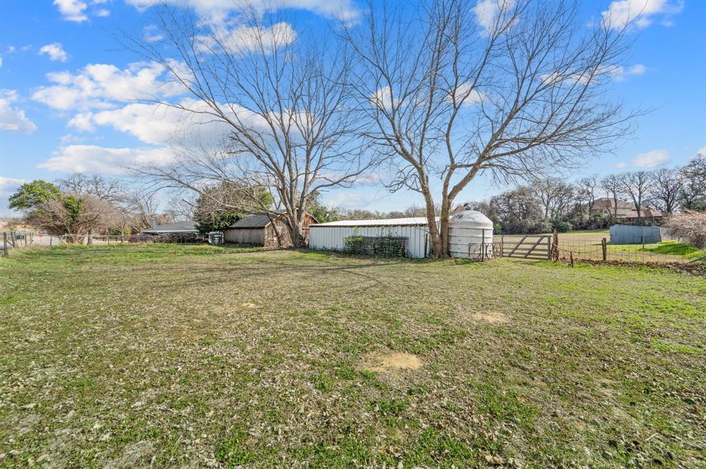 5804 Pleasant Run Road, Unit LAND Colleyville, TX 76034 - Photo 5 of 25 a view of a field with large trees