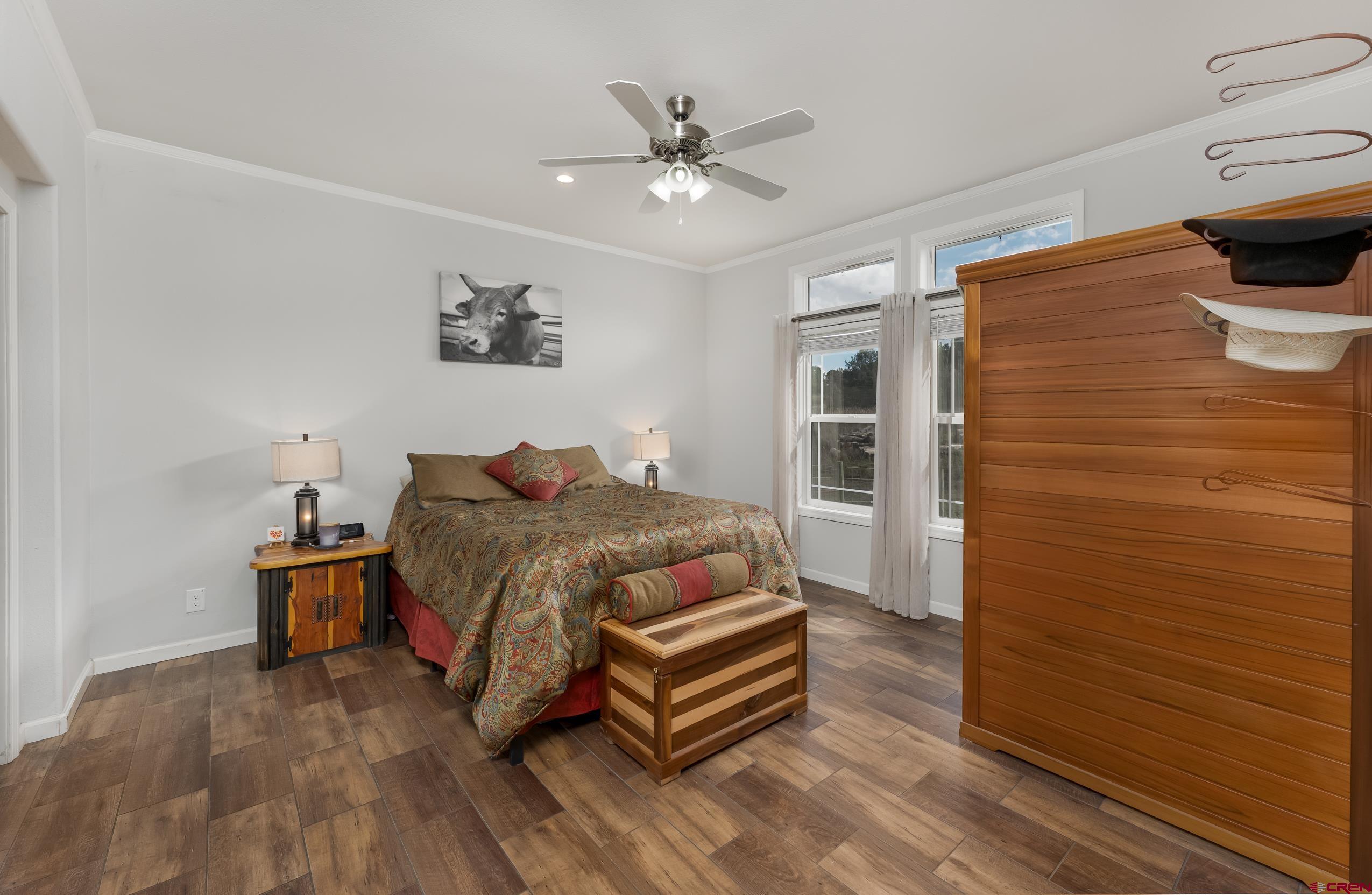 270 Rock Ranch Ignacio, CO 81137 - Photo 20 of 35 a bedroom with a bed and wooden floor