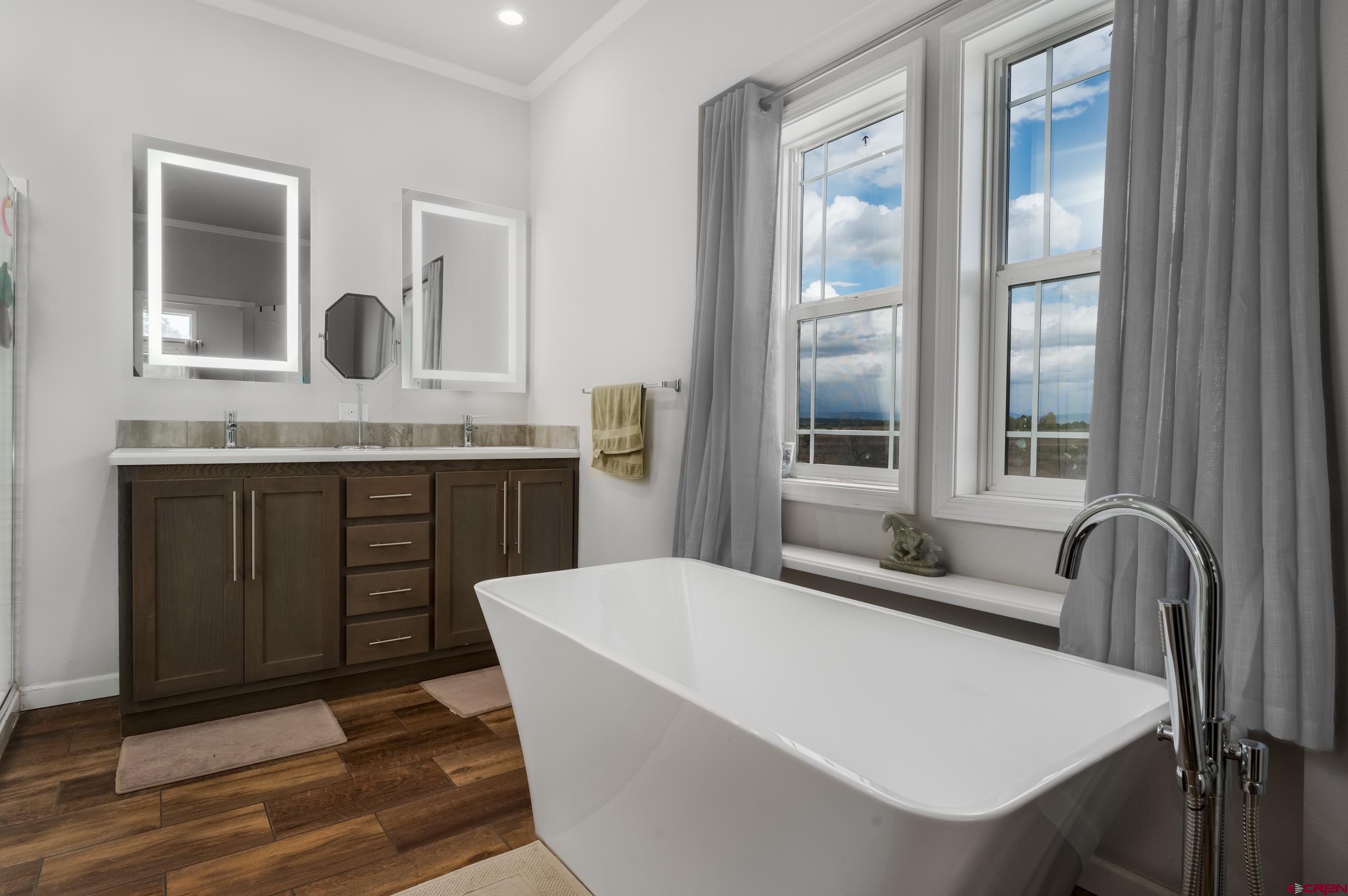 270 Rock Ranch Ignacio, CO 81137 - Photo 22 of 35 a bathroom with a granite countertop sink and a window