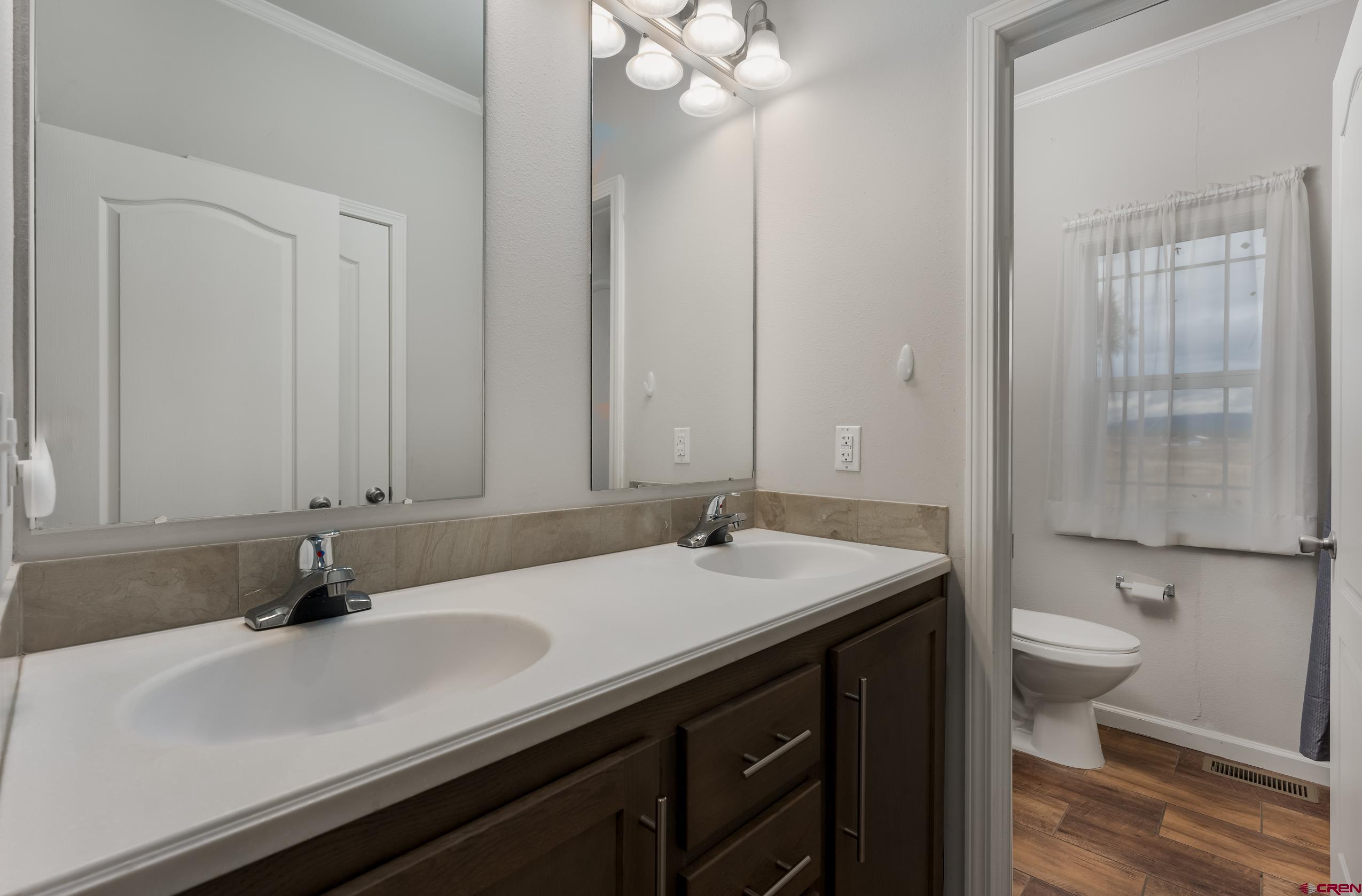 270 Rock Ranch Ignacio, CO 81137 - Photo 29 of 35 a bathroom with a sink and a mirror