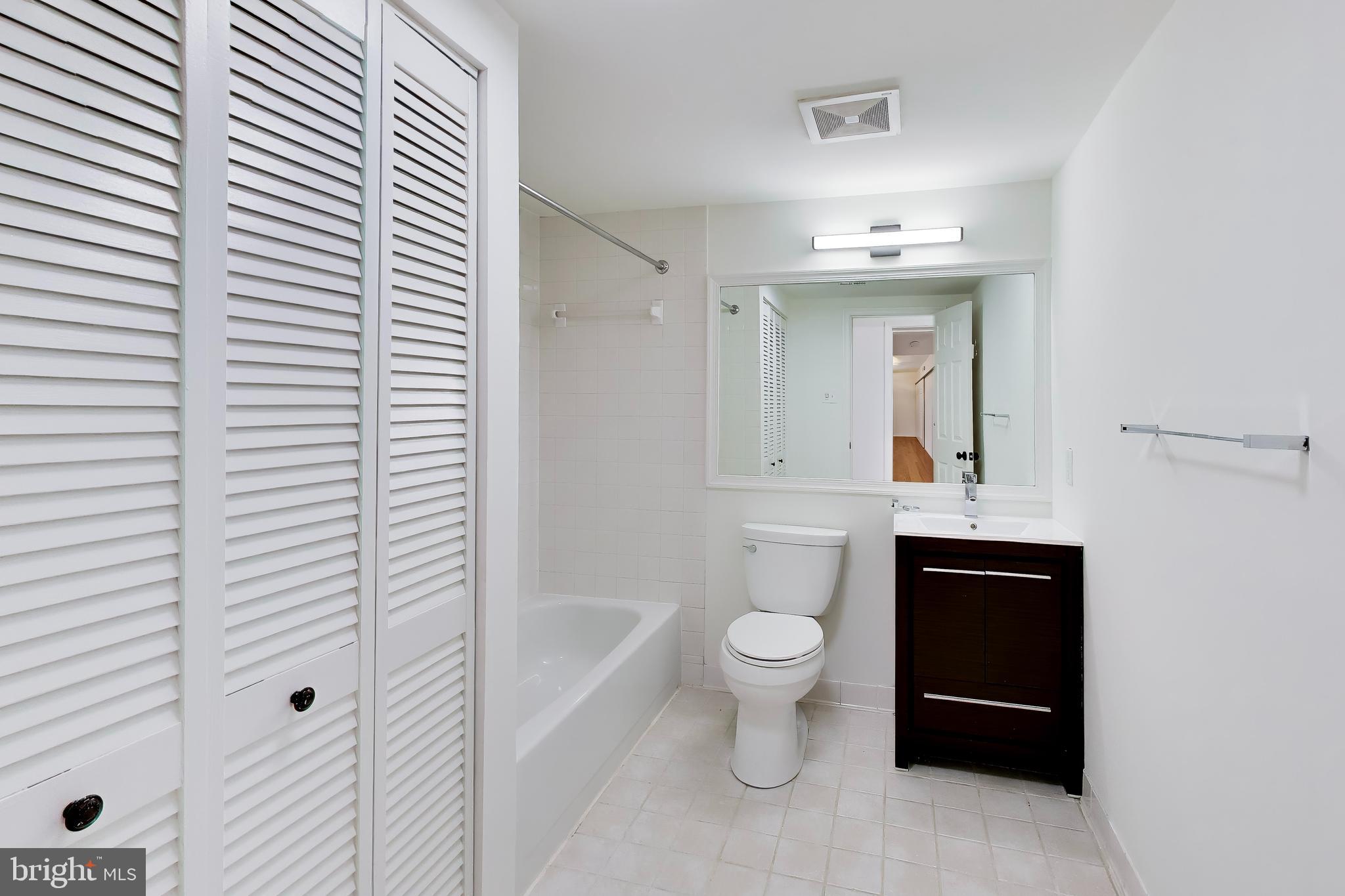 1730 16th Street Northwest, Unit 14 Washington, DC 20009 - Photo 14 of 17 a bathroom with a sink a toilet and shower