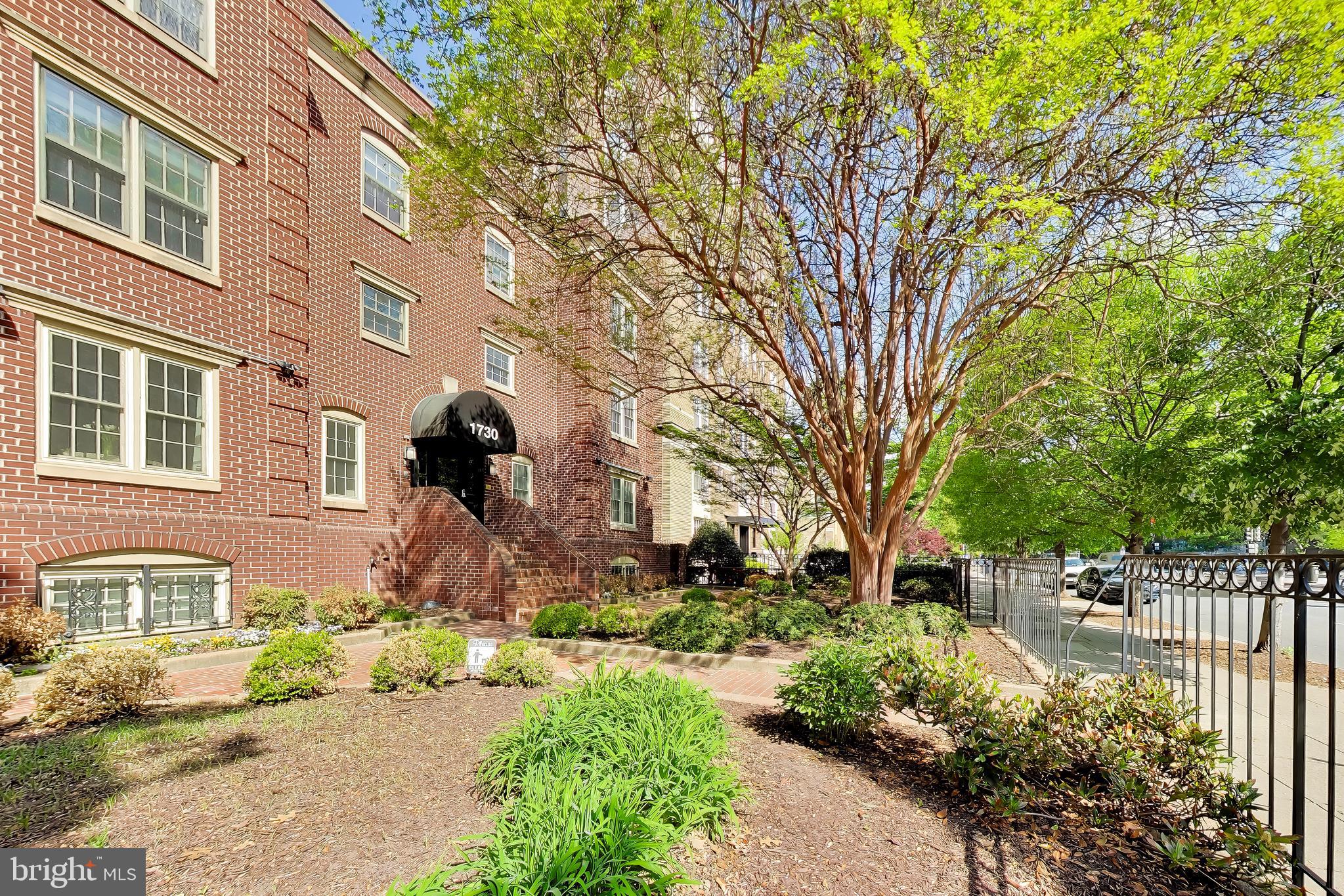 1730 16th Street Northwest, Unit 14 Washington, DC 20009 - Photo 17 of 17 a front view of a house with a yard