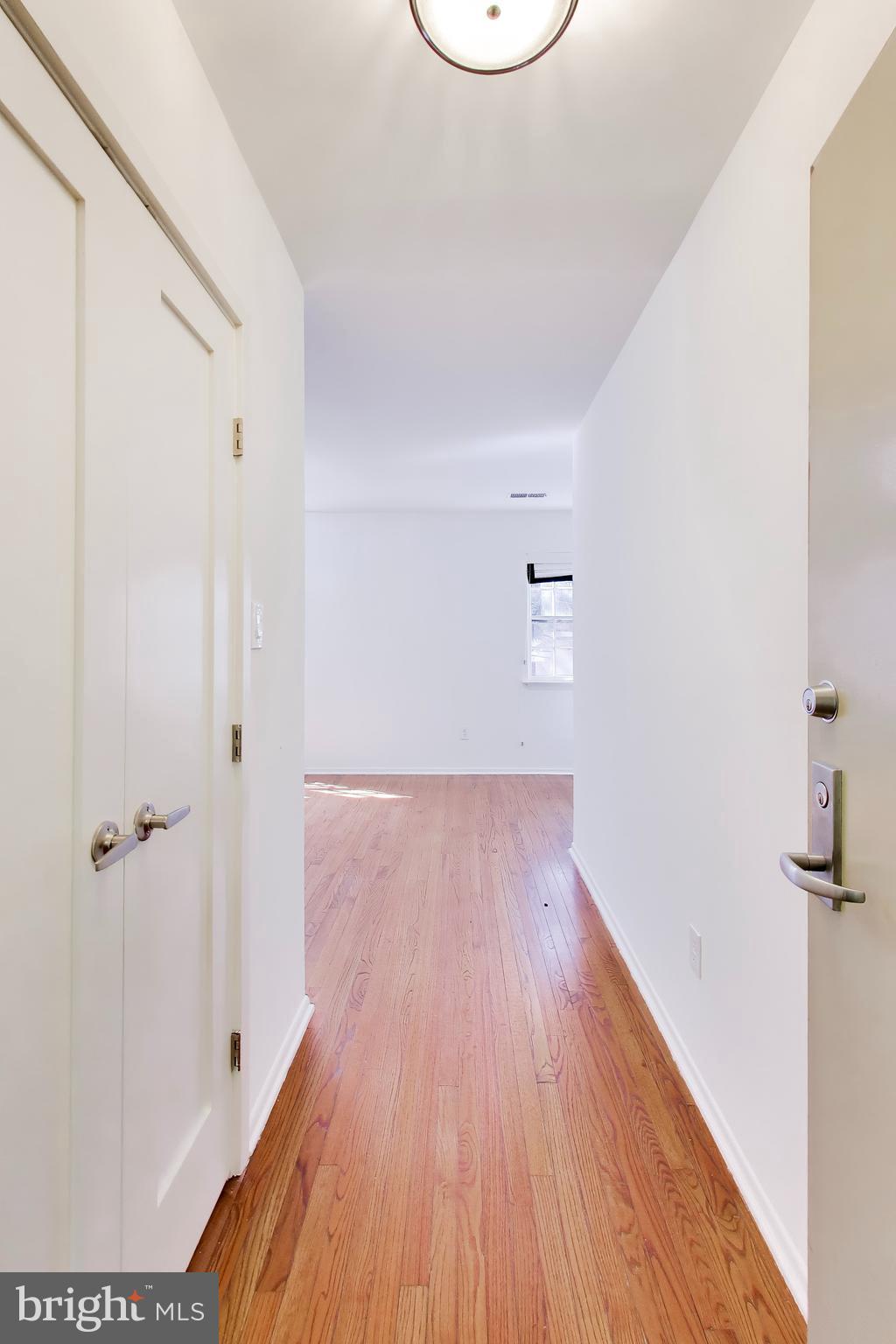 1730 16th Street Northwest, Unit 14 Washington, DC 20009 - Photo 2 of 17 a view of a hallway with wooden floor