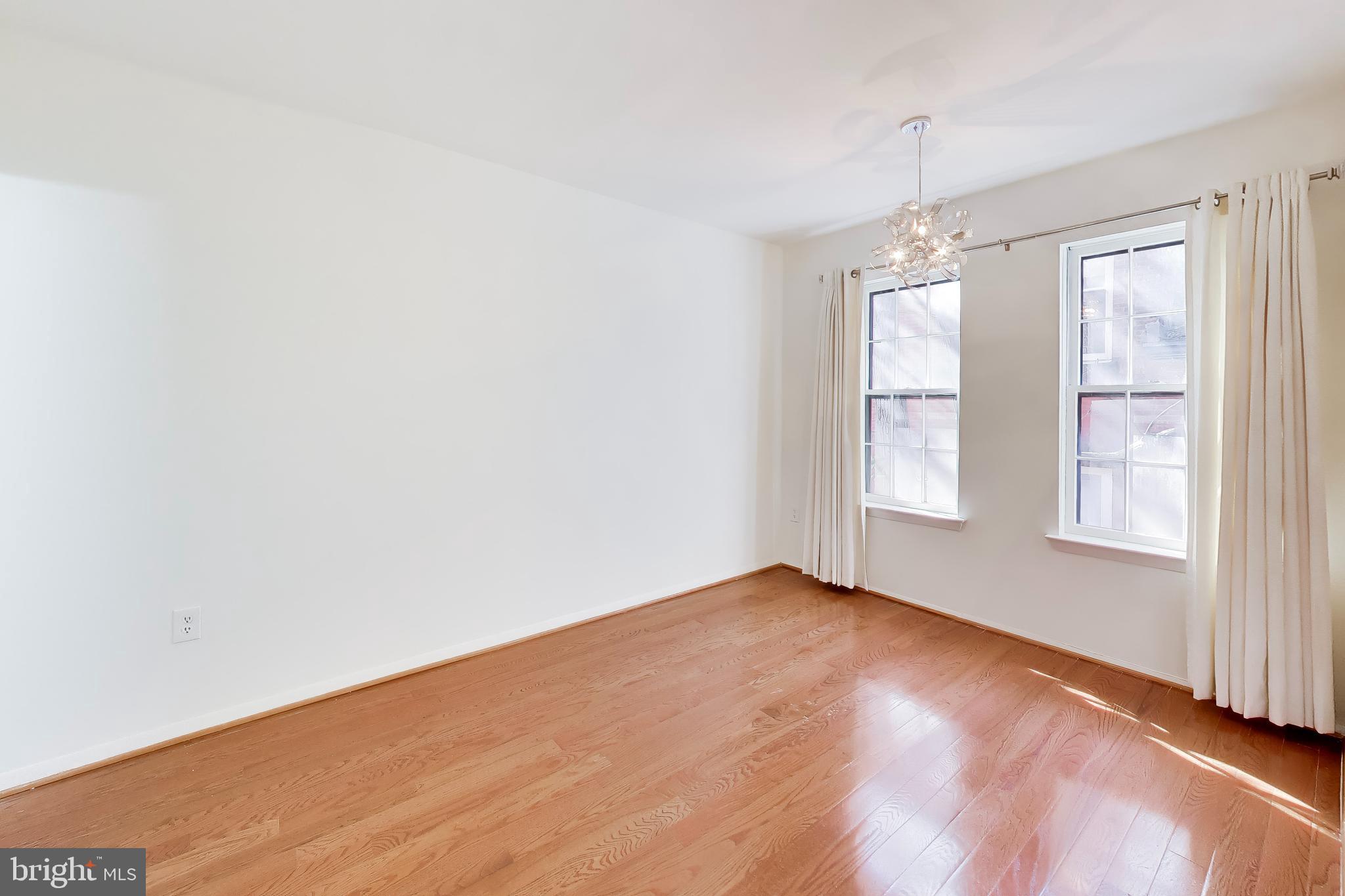 1730 16th Street Northwest, Unit 14 Washington, DC 20009 - Photo 8 of 17 an empty room with windows