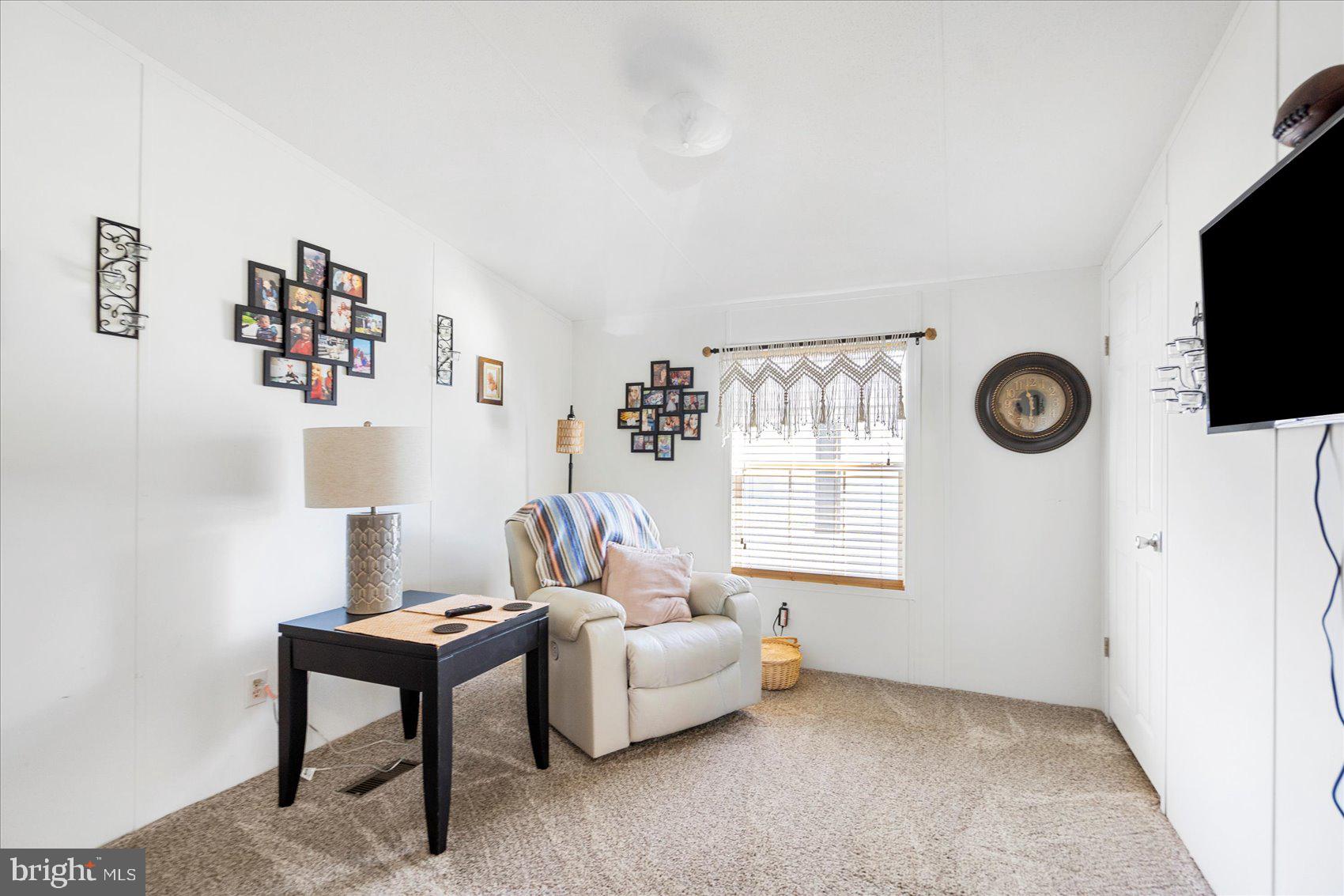 28 Shore Road Sparrows Point, MD 21219 - Photo 16 of 20 a living room with furniture and a window