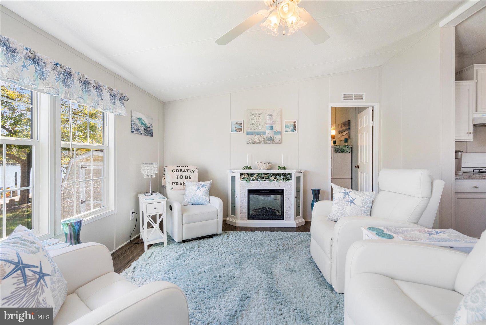 28 Shore Road Sparrows Point, MD 21219 - Photo 3 of 20 a living room with furniture and a fireplace