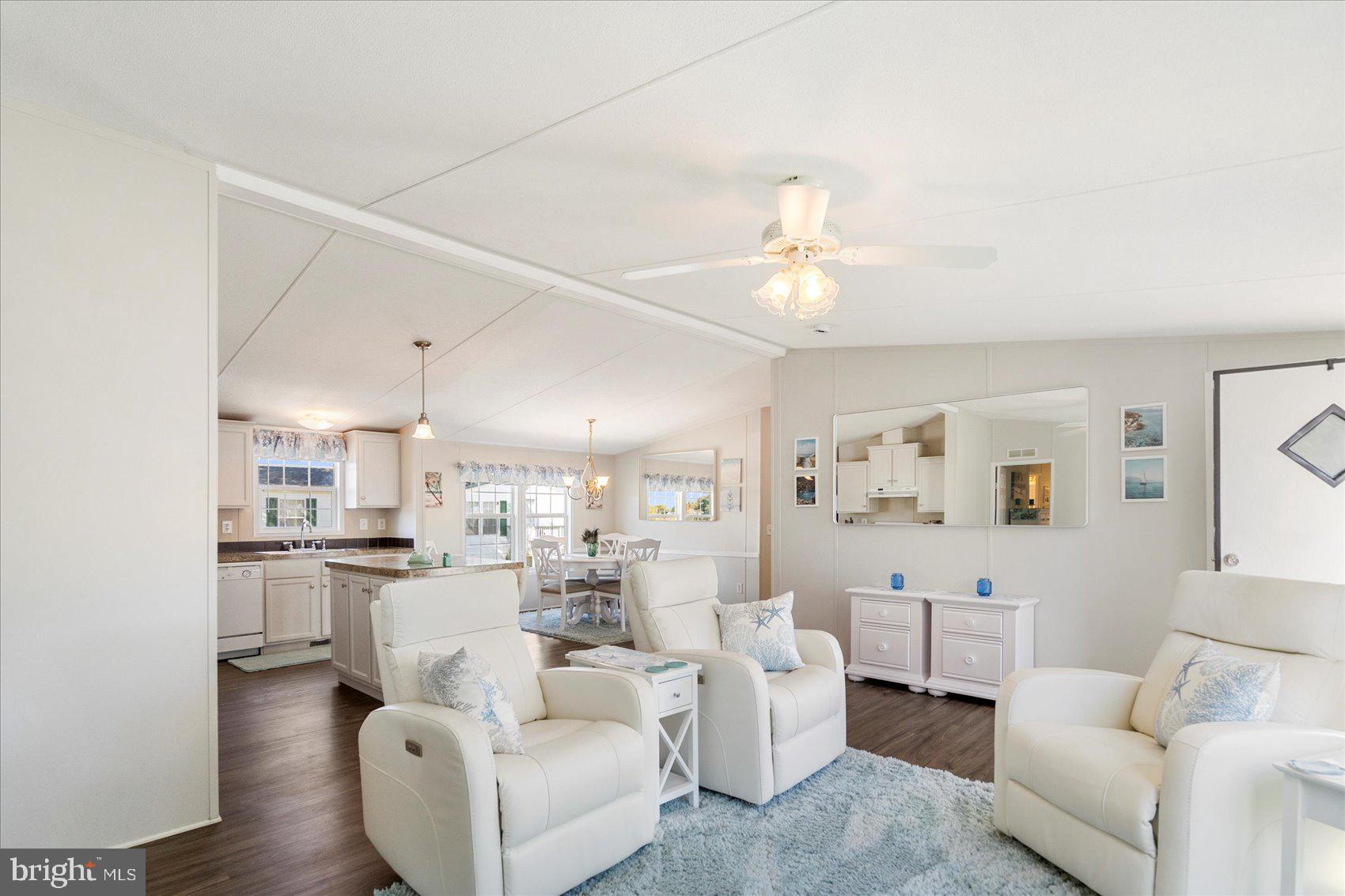 28 Shore Road Sparrows Point, MD 21219 - Photo 8 of 20 a living room with furniture and kitchen view