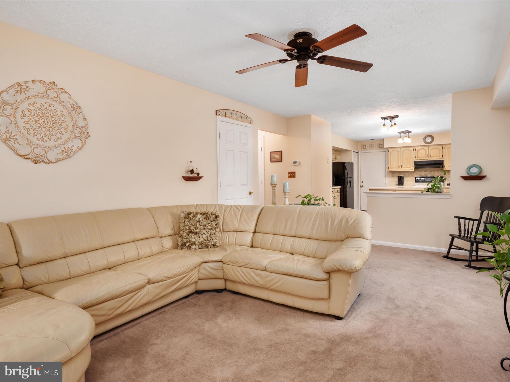 276 Greenridge Drive Dunkirk, MD 20754 - Photo 13 of 49 a living room with furniture and a chandelier