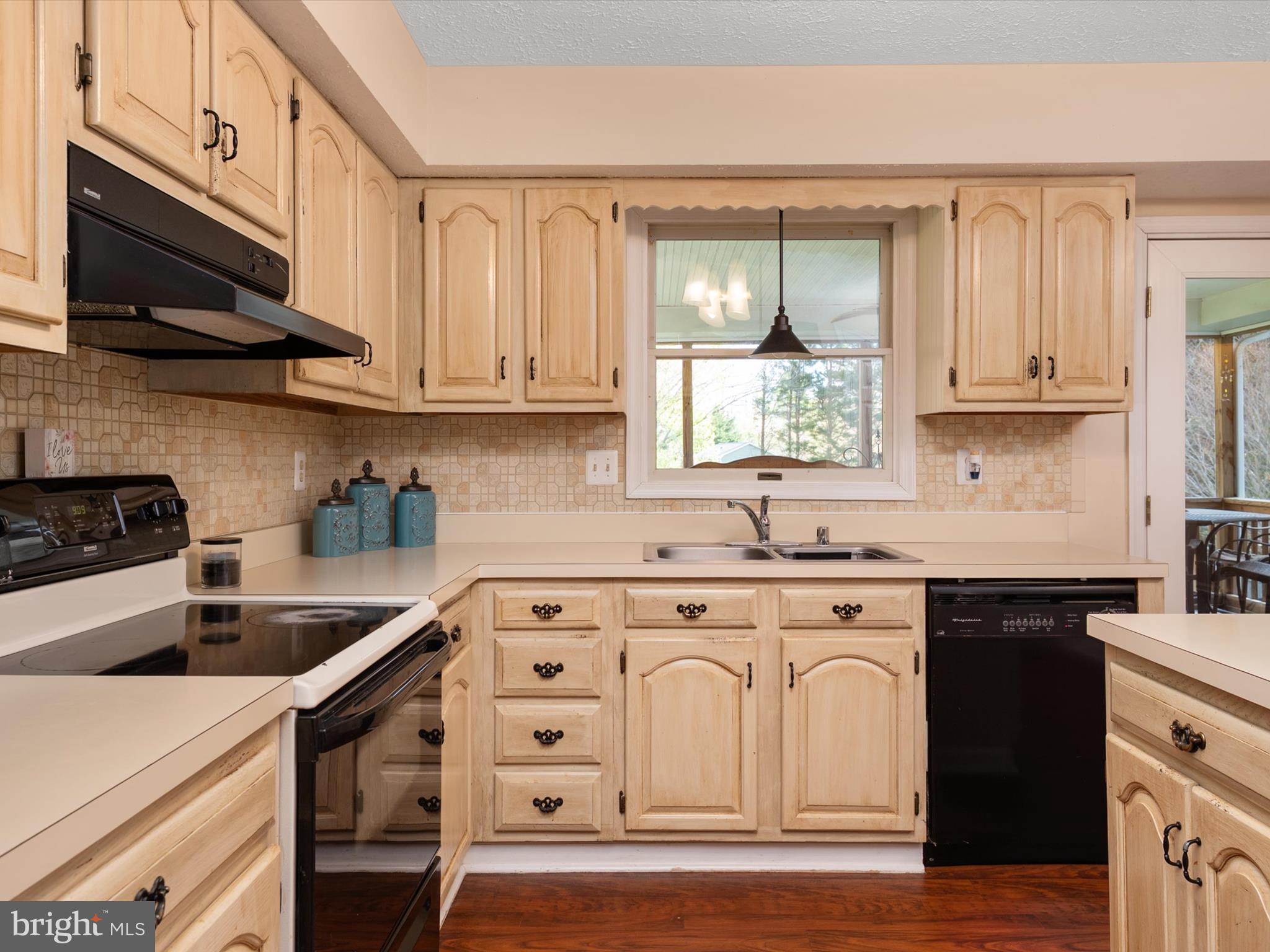 276 Greenridge Drive Dunkirk, MD 20754 - Photo 16 of 49 a kitchen with stainless steel appliances granite countertop a sink a stove and cabinets
