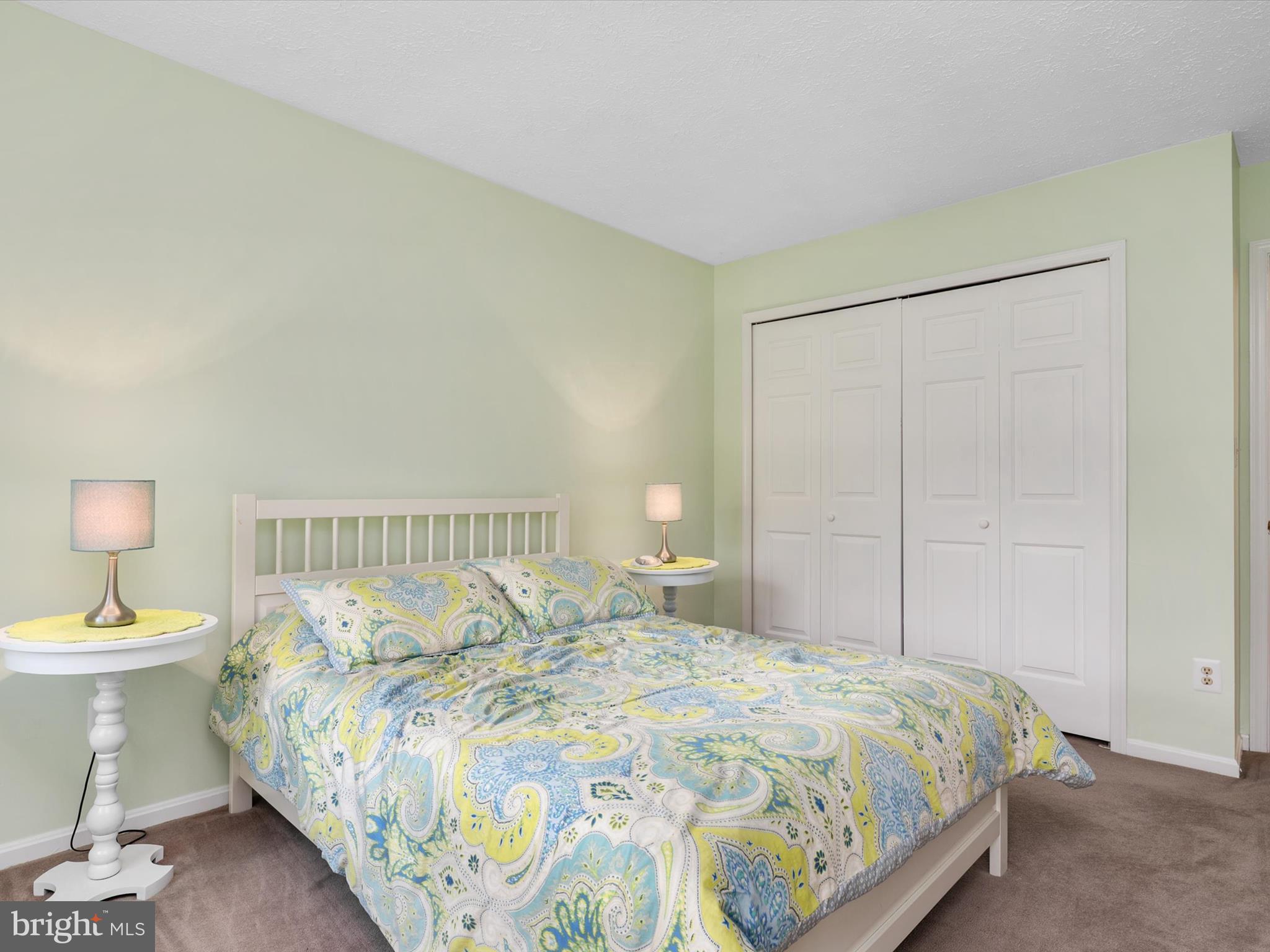 276 Greenridge Drive Dunkirk, MD 20754 - Photo 30 of 49 a bedroom with a bed and lamps