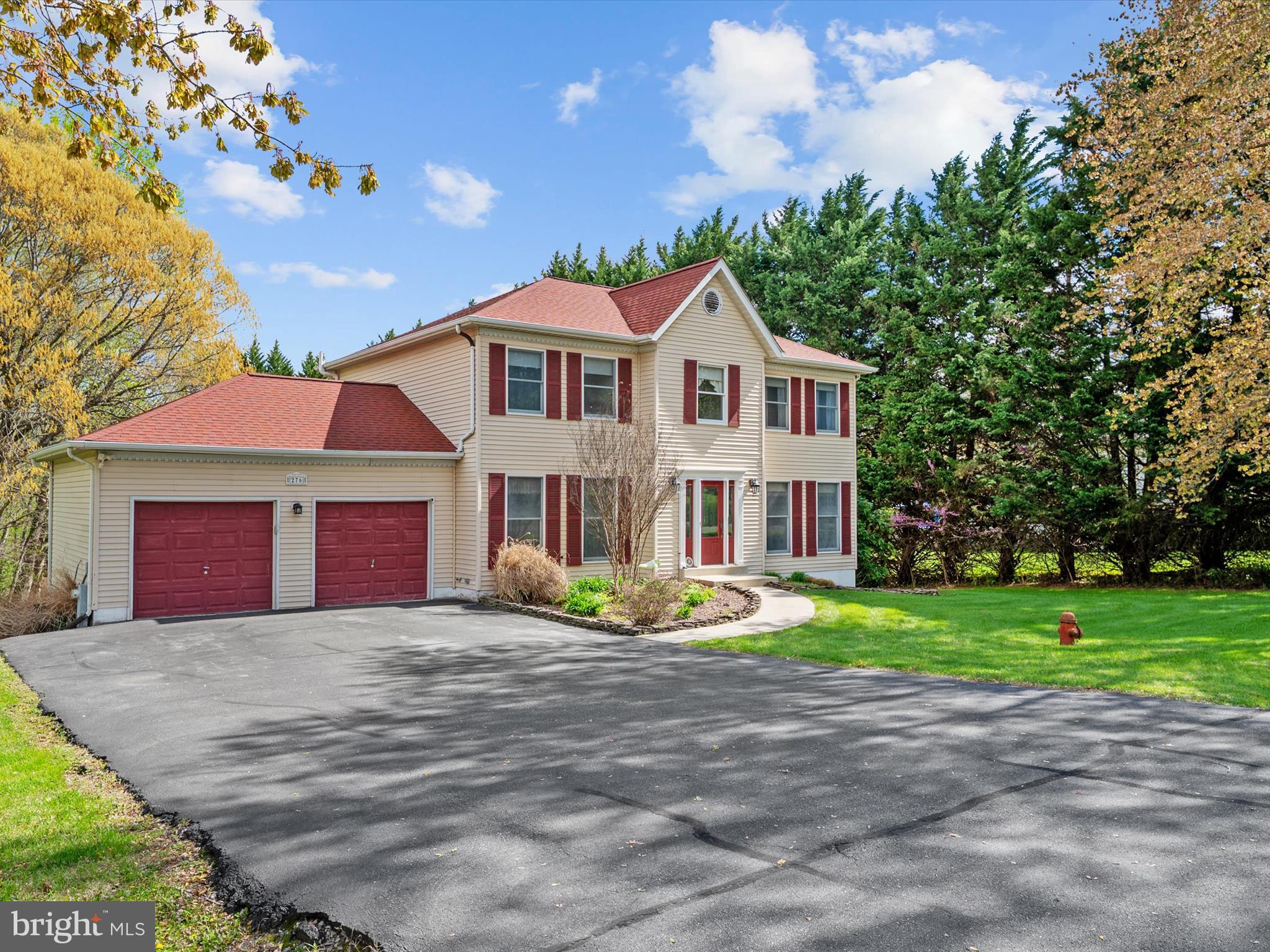 276 Greenridge Drive Dunkirk, MD 20754 - Photo 3 of 49 a front view of a house with a yard and garage