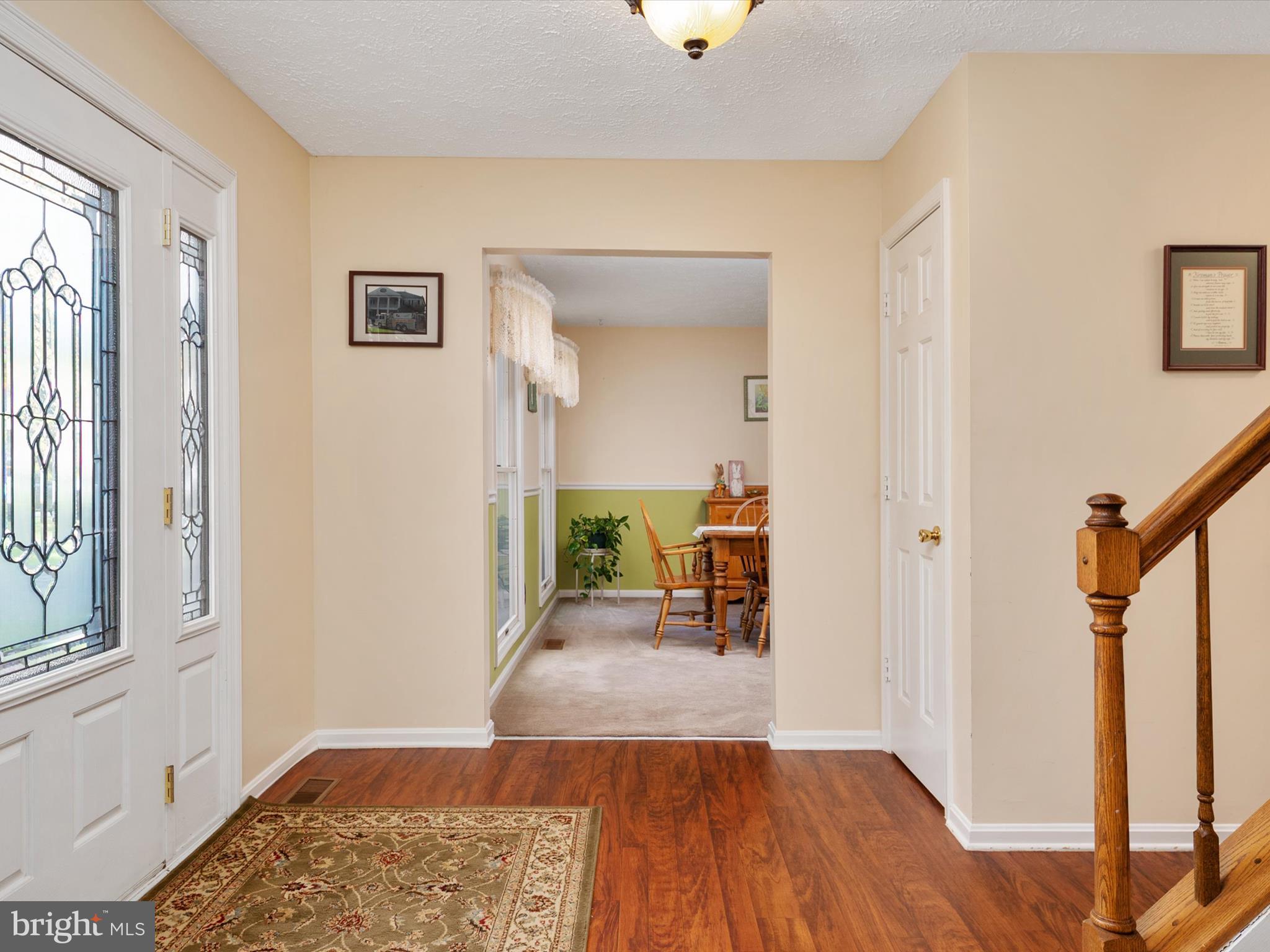 276 Greenridge Drive Dunkirk, MD 20754 - Photo 6 of 49 a hallway with a wooden floor and a chair
