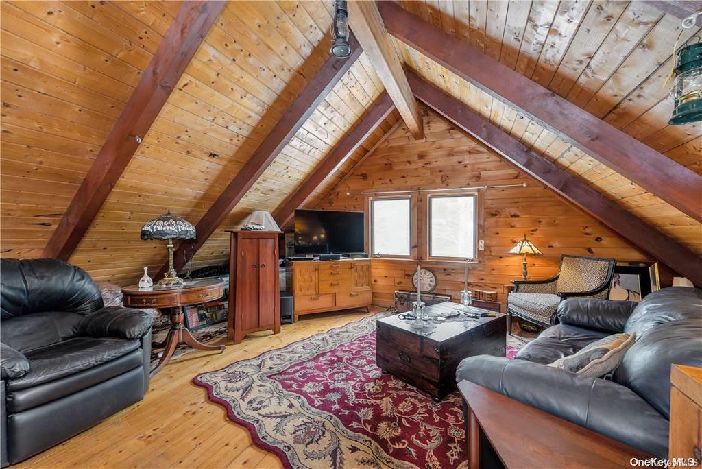 835 Ulster Heights Road Wawarsing, NY 12428 - Photo 12 of 24 a living room with furniture and wooden floor