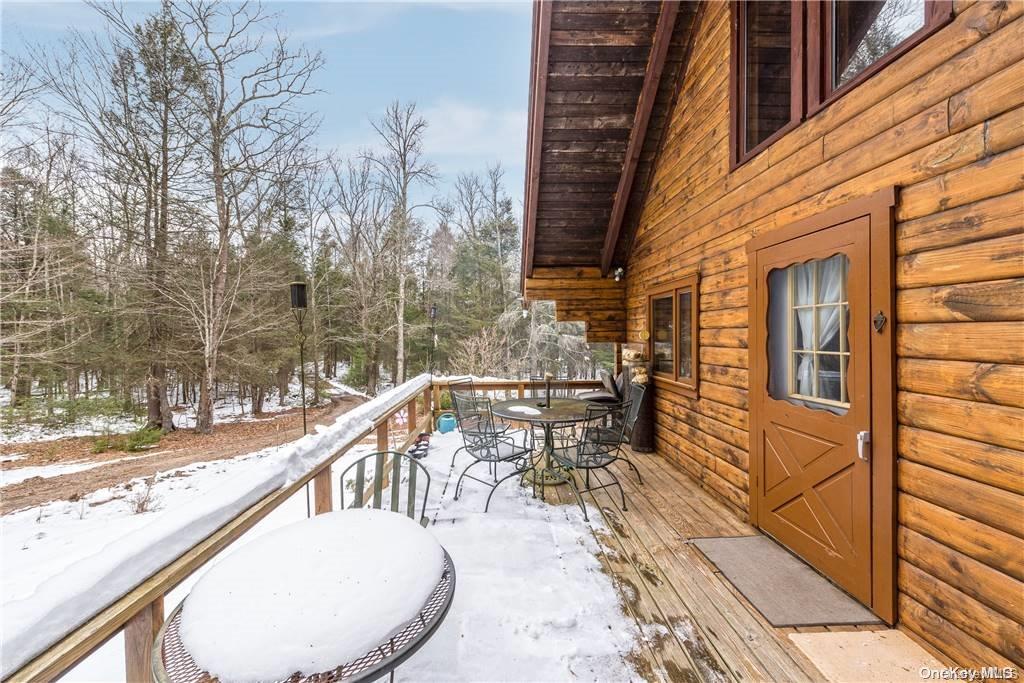 835 Ulster Heights Road Wawarsing, NY 12428 - Photo 2 of 24 a view of balcony with wooden floor and seating space