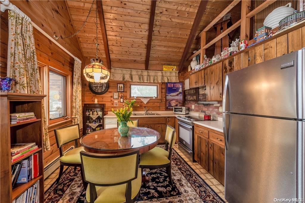 835 Ulster Heights Road Wawarsing, NY 12428 - Photo 7 of 24 a kitchen with a refrigerator and a stove