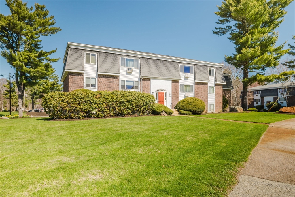 43 Will Drive, Unit 30 Canton, MA 02021 - Photo 1 of 25 front view of a house with a garden