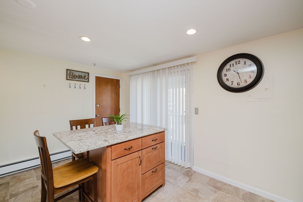 43 Will Drive, Unit 30 Canton, MA 02021 - Photo 11 of 25 a view of a table and a chair in a room