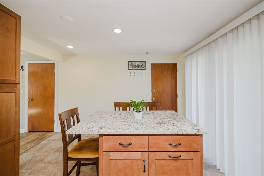 43 Will Drive, Unit 30 Canton, MA 02021 - Photo 12 of 25 a dining table with chair and bathroom
