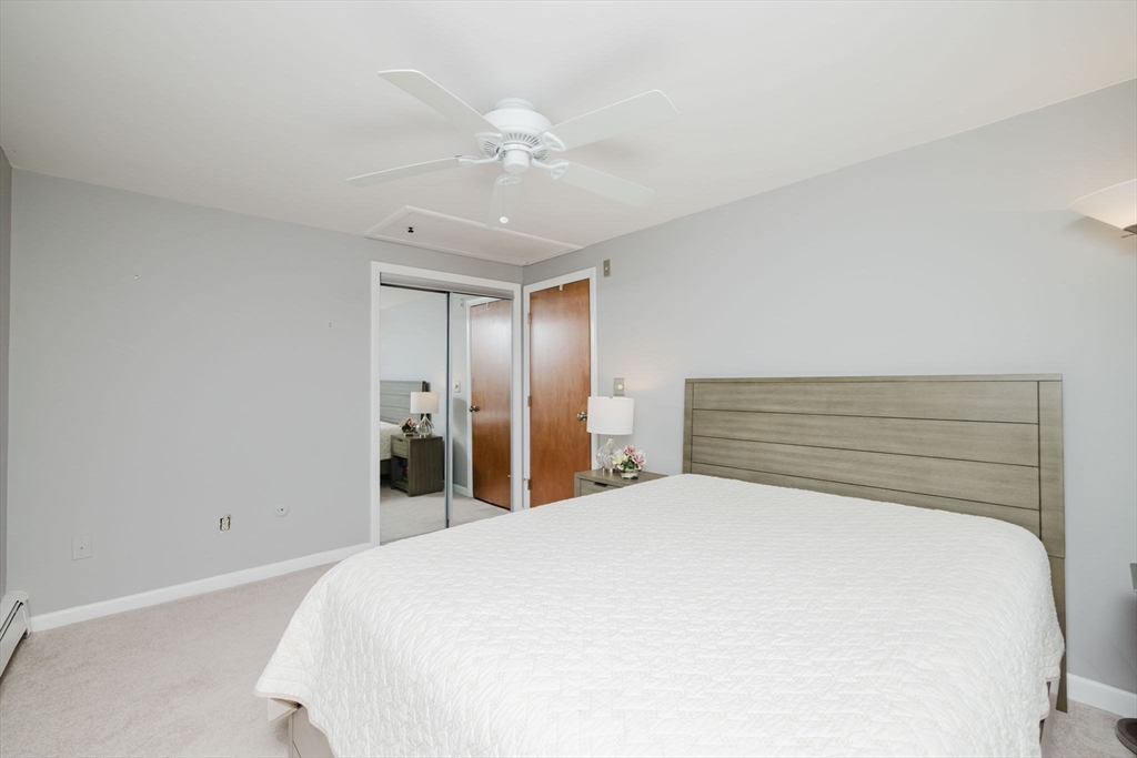 43 Will Drive, Unit 30 Canton, MA 02021 - Photo 14 of 25 a large bed sitting in a bedroom and closet