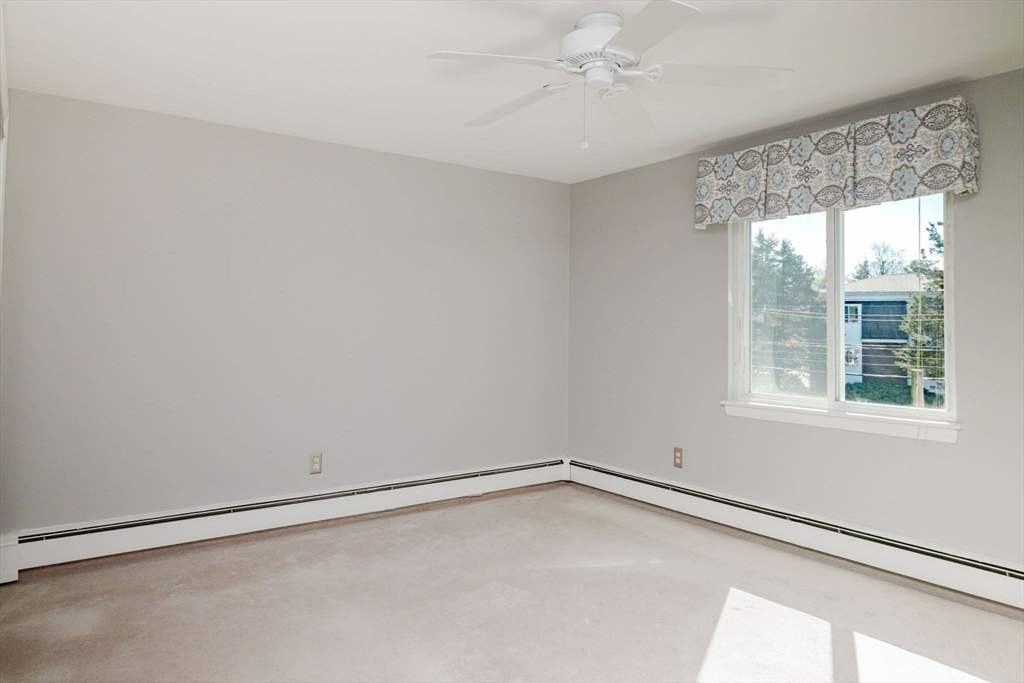 43 Will Drive, Unit 30 Canton, MA 02021 - Photo 15 of 25 wooden floor in an empty room with a window