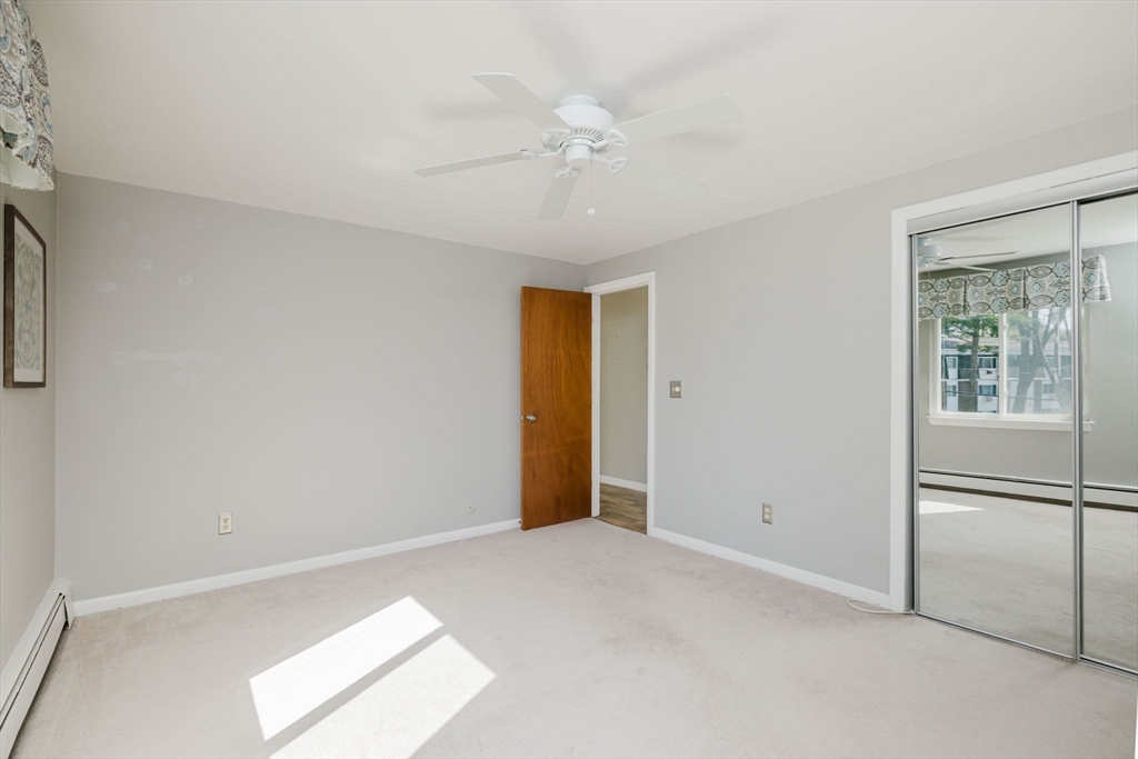 43 Will Drive, Unit 30 Canton, MA 02021 - Photo 17 of 25 a view of an empty room with a window
