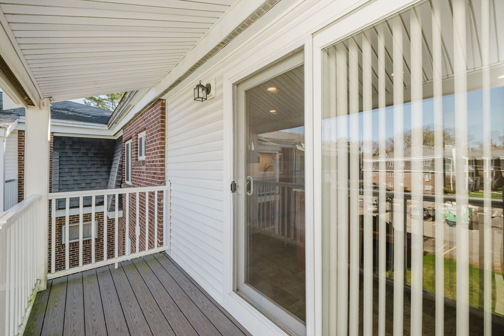 43 Will Drive, Unit 30 Canton, MA 02021 - Photo 20 of 25 a view of wooden balcony