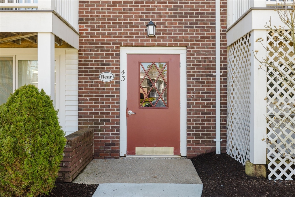 43 Will Drive, Unit 30 Canton, MA 02021 - Photo 2 of 25 a view of a brick house with a street