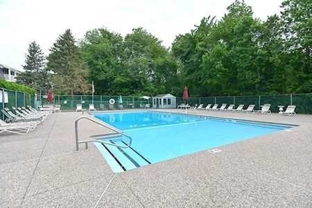 43 Will Drive, Unit 30 Canton, MA 02021 - Photo 21 of 25 a view of a swimming pool with an outdoor seating
