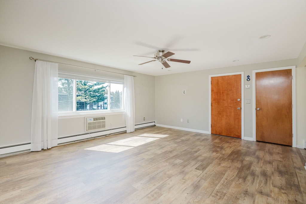 43 Will Drive, Unit 30 Canton, MA 02021 - Photo 4 of 25 a view of an empty room with a window