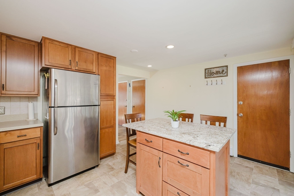 43 Will Drive, Unit 30 Canton, MA 02021 - Photo 10 of 25 a kitchen with stainless steel appliances granite countertop a refrigerator and a sink