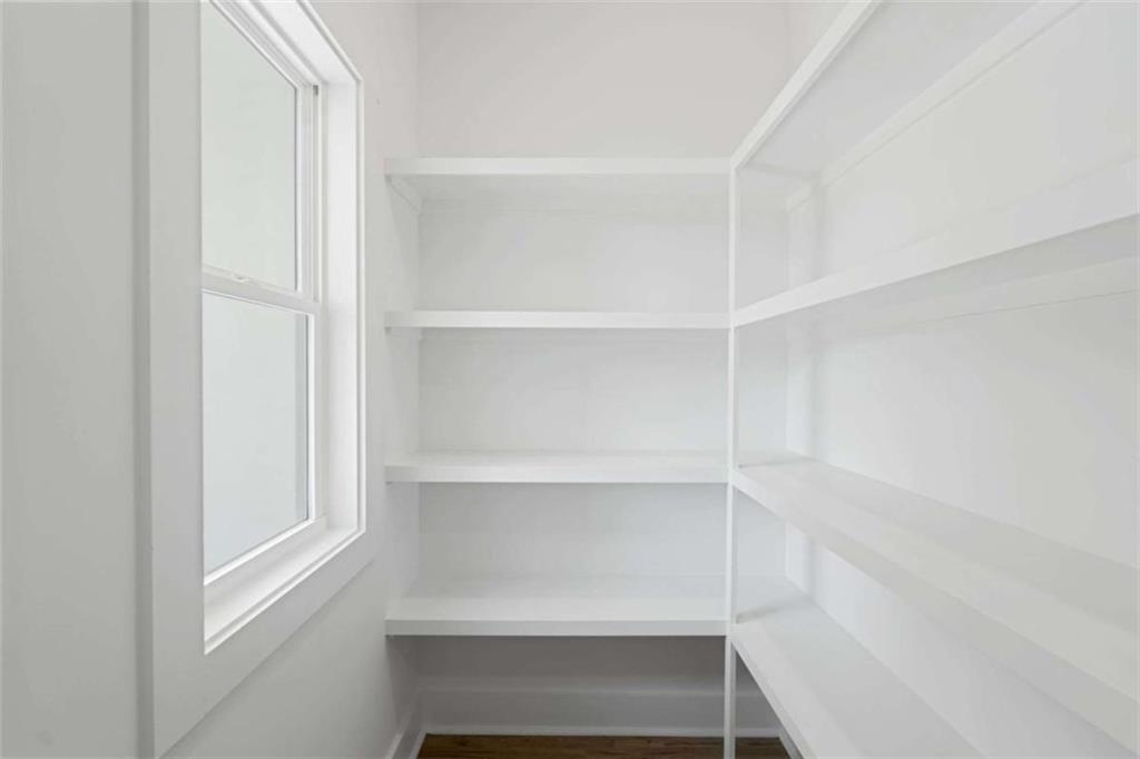 11691 Hazelbrand Road Northeast Covington, GA 30014 - Photo 17 of 53 a view of walk in closet with empty racks
