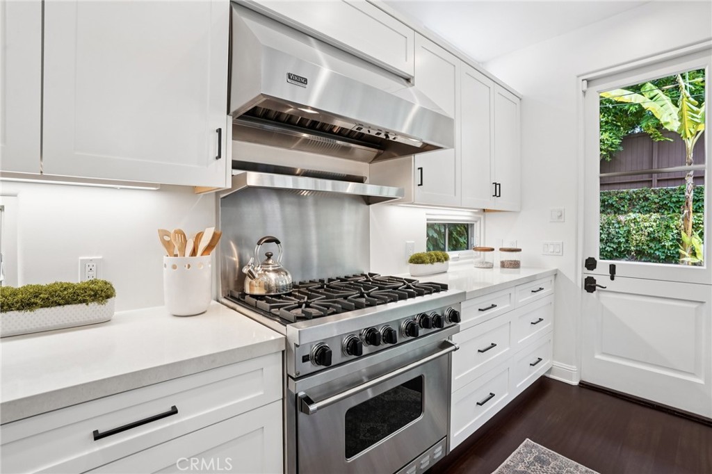 587 26th Street Manhattan Beach, CA 90266 - Photo 25 of 67 a kitchen with stainless steel appliances granite countertop a stove and a white cabinets