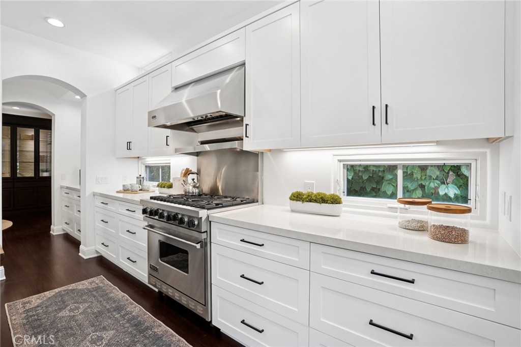 587 26th Street Manhattan Beach, CA 90266 - Photo 27 of 67 a kitchen with stainless steel appliances white cabinets and a stove top oven