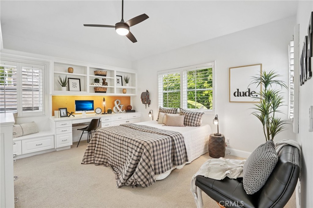 587 26th Street Manhattan Beach, CA 90266 - Photo 31 of 67 a bedroom with a bed a couch and a potted plant